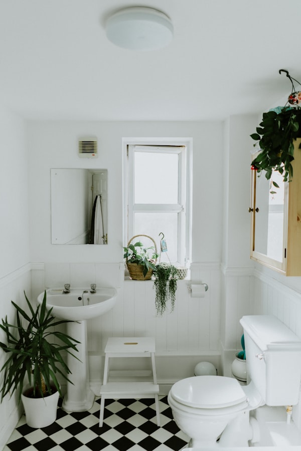 Small bathroom renovation with wall-hung vanity, large format tiles, frameless shower screen and recessed niche — compact Melbourne bathroom design